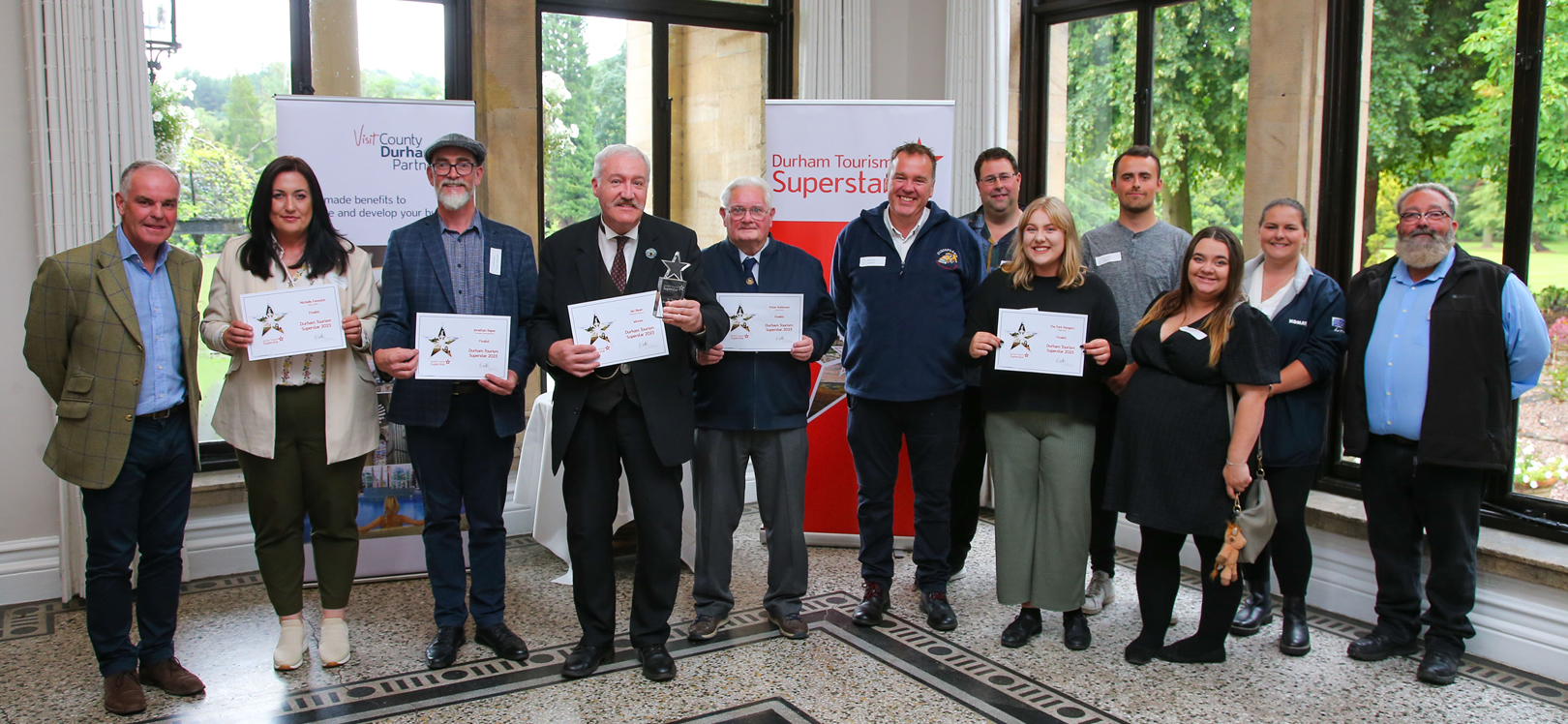 Duncan Peake (Left), Interim Chair of Visit County Durham, with the Durham Tourism Superstar 2023 finalists