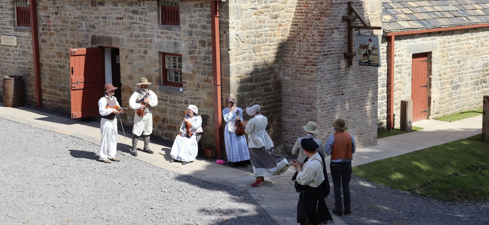 People stood outside of Drovers Tavern at Beamish Museum.