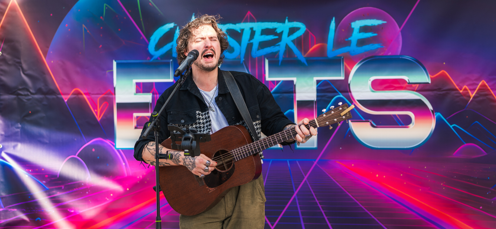 man singing and playing guitar at Chester le EATS food festival