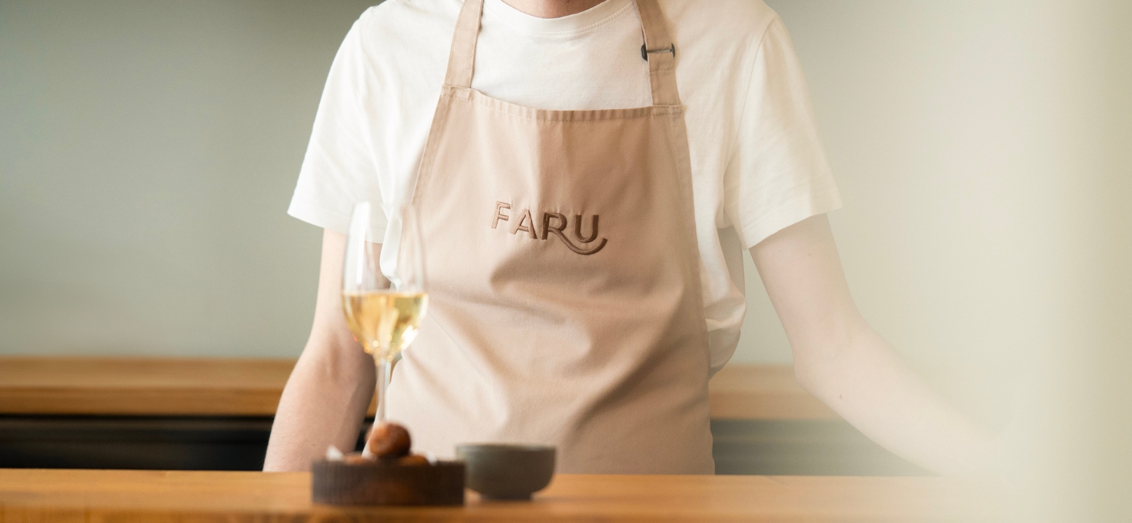 A chef with a plate of food