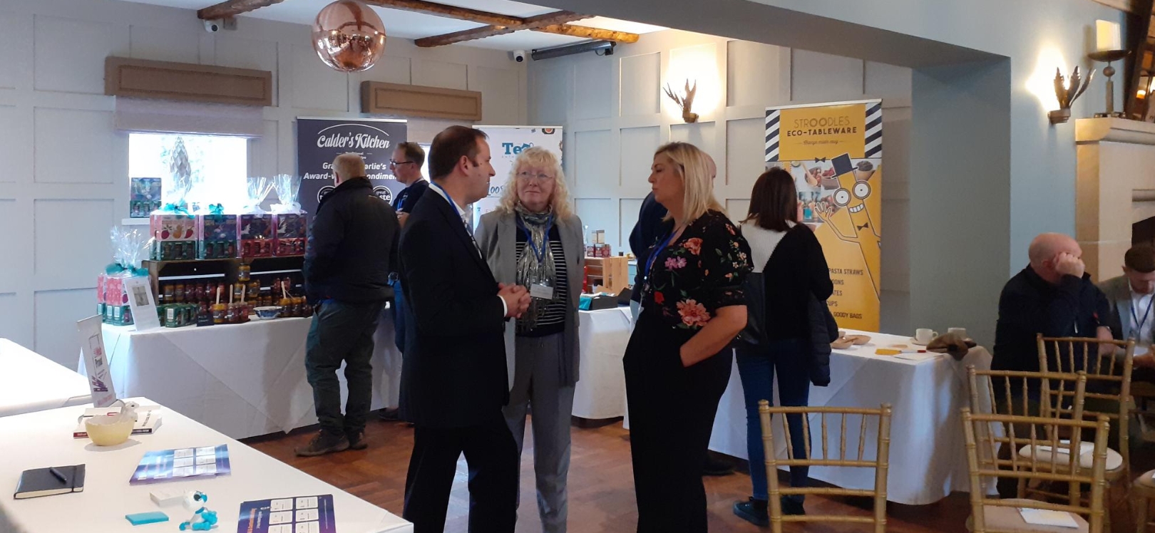 People talking to the suppliers at the autumn conference