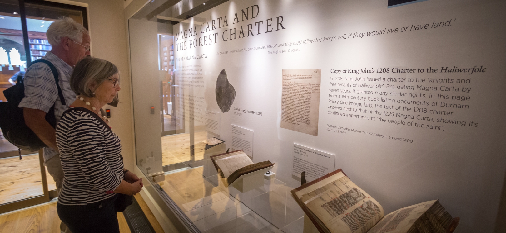 People looking at the Magna Carta exhibition