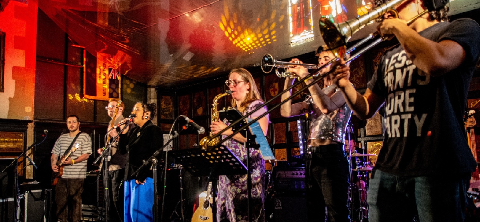 A group of people playing musical instruments by Gordon Armstrong